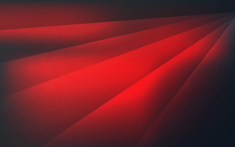 Abstract red light rays spreading across a dark background